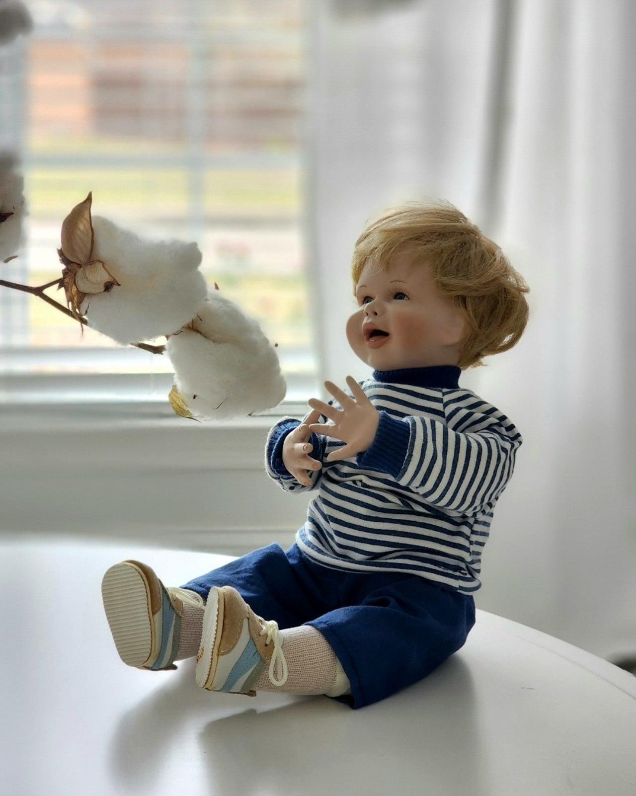 Porcelain baby boy doll